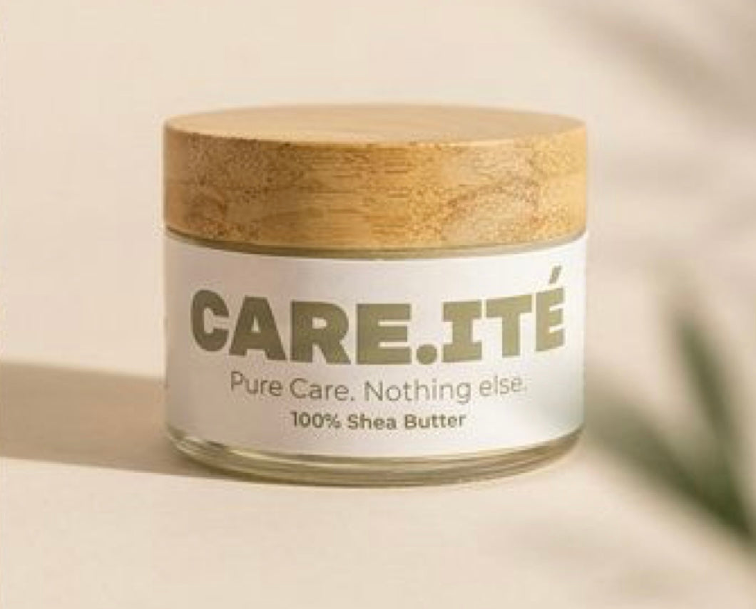 Glass jar of CARE.ITÉ 100% pure shea butter with bamboo lid on neutral background.